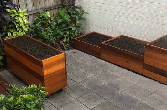 Bloom Box timber planter boxes in a small courtyard